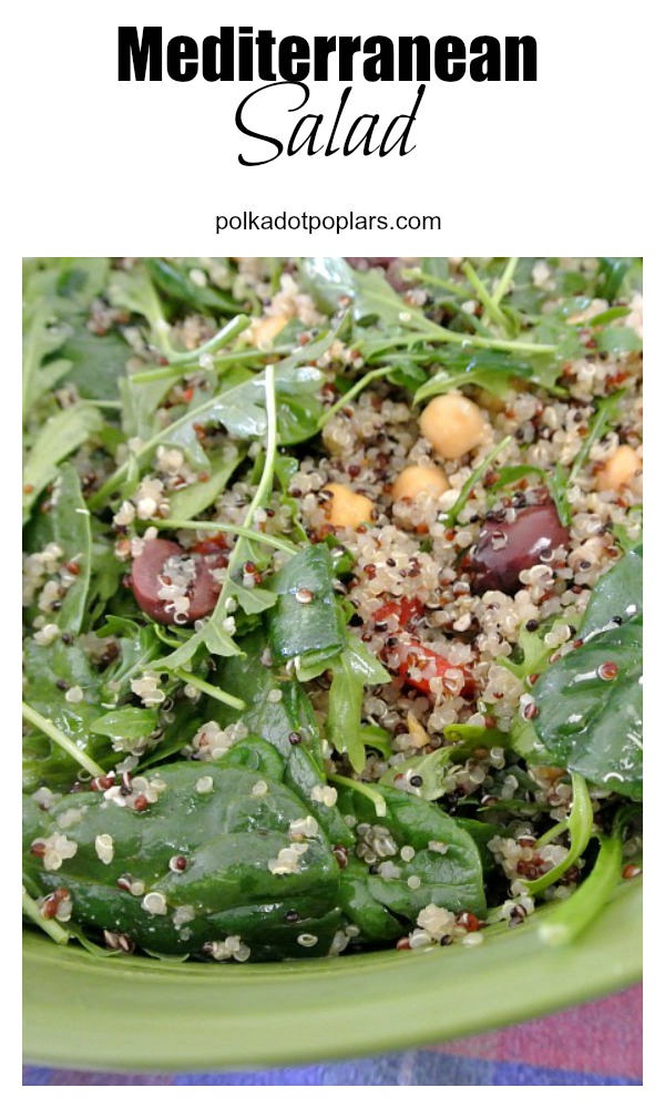 This mediterranean salad is perfect for a summer day. Contains quino, spinach, arugula, Kalamata olives, roasted red bell pepper, feta cheese, olive oil,  balsamic vinegar, basil, thyme, and garbanzo beans
