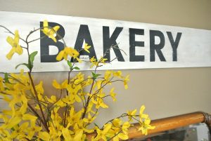 Make this sign in one hour using just a few supplies like wood, alphabet stickers, and paint.